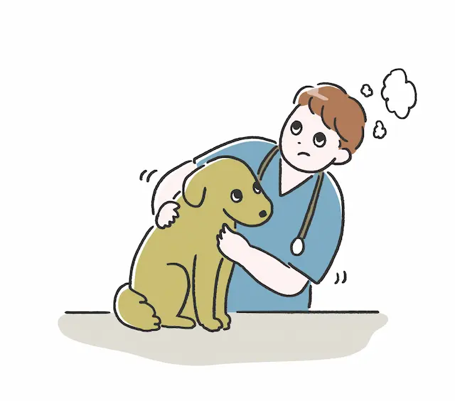 獣医の診察を受ける犬